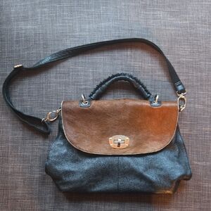 Elegant Black Leather and Brown Cowhide Crossbody bag